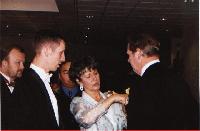 Donna adjusting Bob's corsage